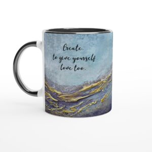 White ceramic coffee mug featuring a cropped blue and gold abstract painting with the quote "Create to give yourself love too," perfect as an inspirational gift for artists and creatives.